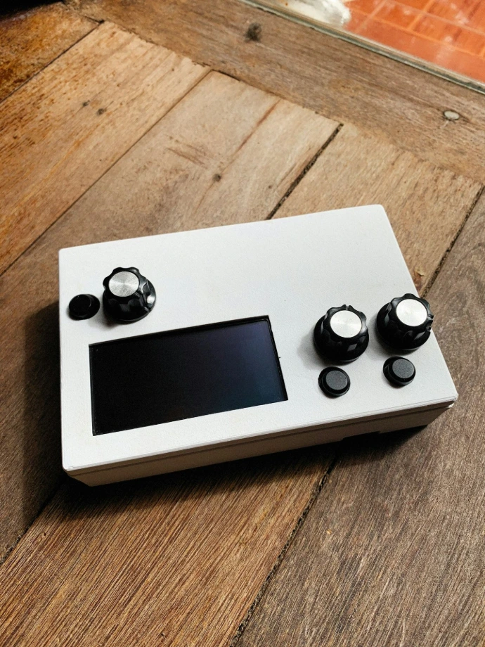 a game controller sitting on top of a wooden floor